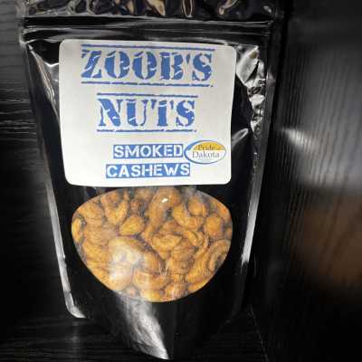Bag of smoked cashews with a clear window and blue label
