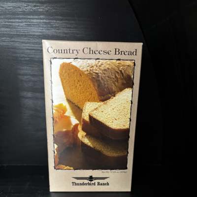 Box of Country Cheese Bread mix on a dark surface