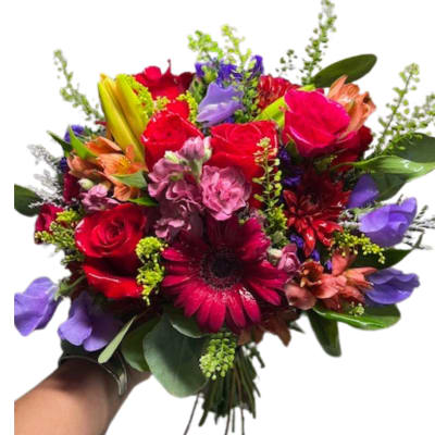 Handheld bouquet of red, pink, purple, and orange flowers