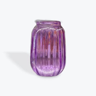Purple ribbed glass vase on a white background