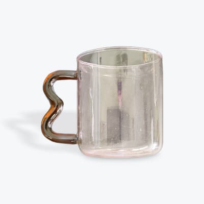 Clear glass mug with a wavy amber handle