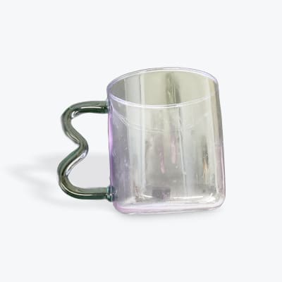 Clear glass mug with a wavy green handle
