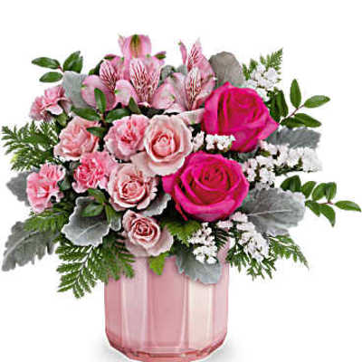Pink roses and carnations in a pink glass vase