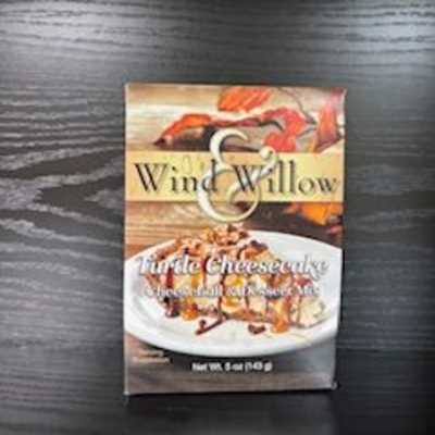 Box of Wind & Willow turtle cheesecake mix on a dark table