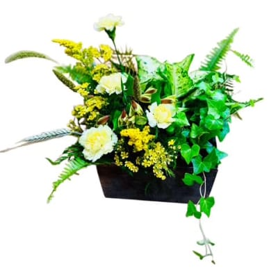 White and yellow floral arrangement in a black rectangular container