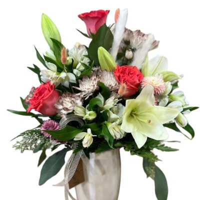 Mixed bouquet with lilies, roses, and alstroemeria in a vase