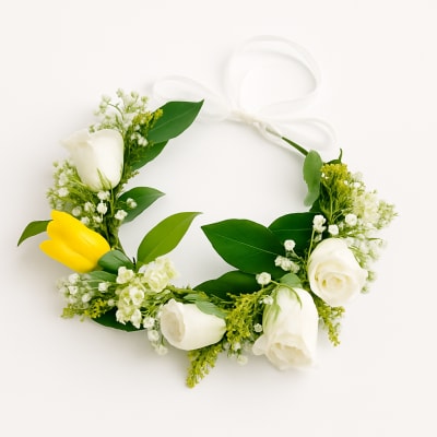 Floral wreath with white and yellow tulips and a white ribbon bow