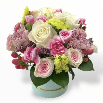 Pink and white rose bouquet in a round blue box