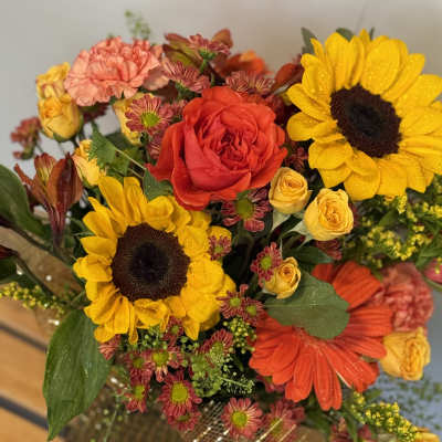 Bouquet with sunflowers, red roses, and orange gerbera daisies