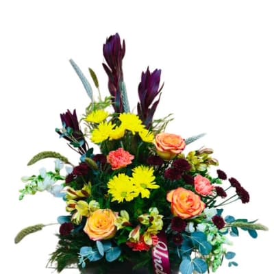 Mixed bouquet with yellow daisies and peach roses in a black container