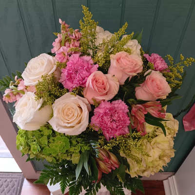 Bouquet of pink and white roses with carnations and hydrangeas