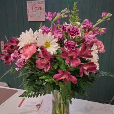 Pink and white mixed bouquet in a clear glass vase