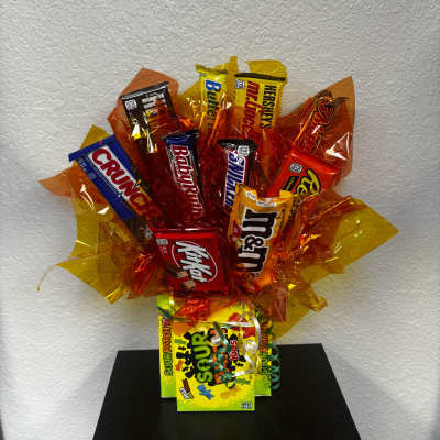 Candy bouquet with assorted chocolate bars and Sour Patch Kids packages