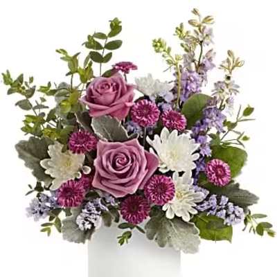 Lavender roses and white daisies in a white vase