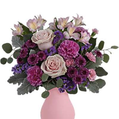 Pink and purple mixed bouquet in a pink vase
