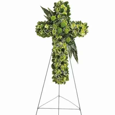 Green floral cross on a metal easel stand