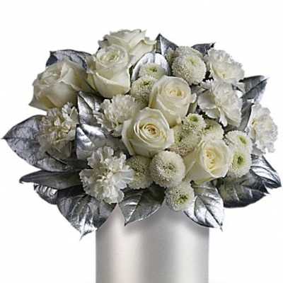 White rose bouquet in a silver vase with metallic leaves
