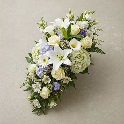 White floral spray with roses, lilies, calla lilies, and hydrangeas