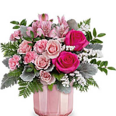 Pink rose bouquet in a pink glass vase