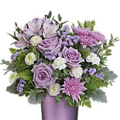 Lavender and pink bouquet in a purple glass vase