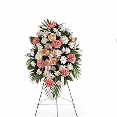 Standing floral spray with pink and white flowers on an easel