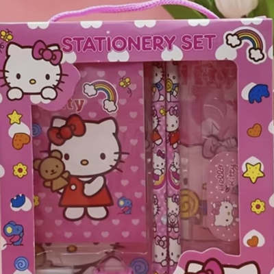 Pink Hello Kitty stationery set in a gift box with notebook and pens.