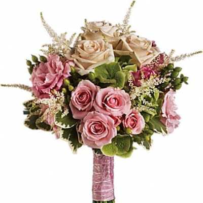 Bouquet of pink and cream roses with greenery and a pink wrapped handle