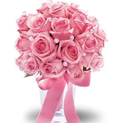 Pink rose bouquet with pearl accents in a clear vase