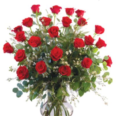 Red roses arranged in a clear glass vase