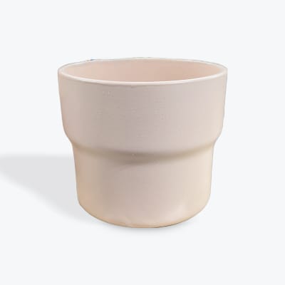 Beige ceramic planter pot on a white background