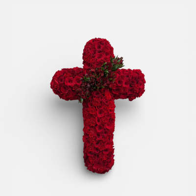 Red rose cross-shaped floral arrangement on a white background