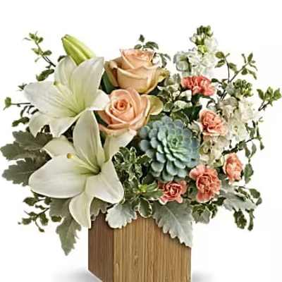 Flower arrangement with white lilies, peach roses, and a blue succulent in a wooden vase