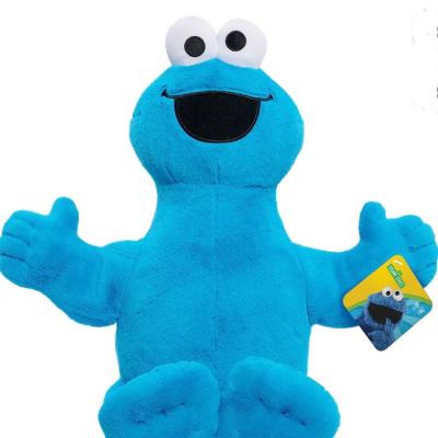 Blue Cookie Monster plush toy with outstretched arms