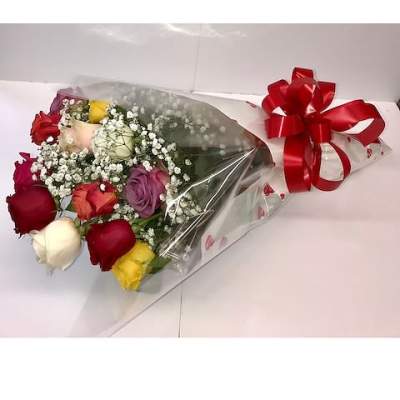 Bouquet of multicolored roses wrapped in clear plastic with a red bow