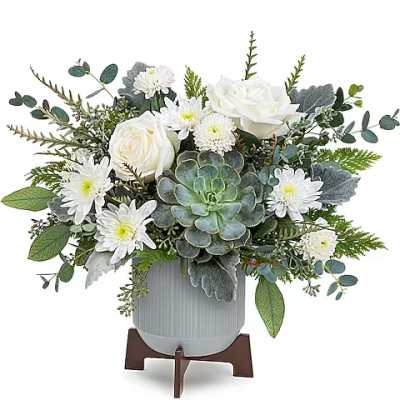 White roses and daisies in a gray vase with a succulent centerpiece