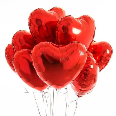 Cluster of red heart-shaped balloons on strings