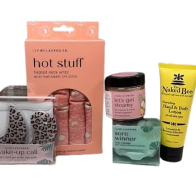 Assorted self-care gift set with lotion, masks, and a neck wrap