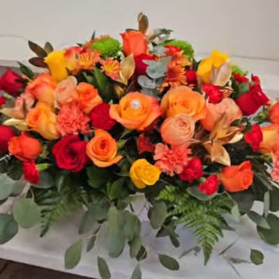 Colorful bouquet of roses and mixed flowers with greenery