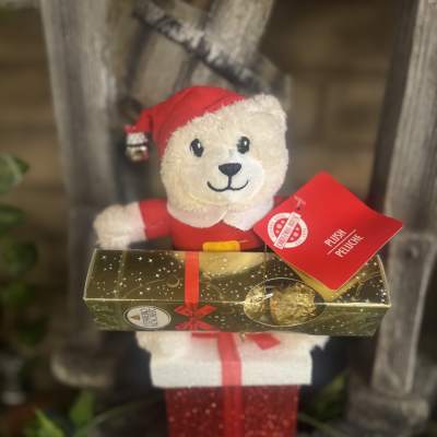 Plush teddy bear holding a box of chocolates and a gift box