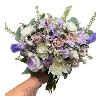 Handheld bouquet of lavender, blush, and white flowers