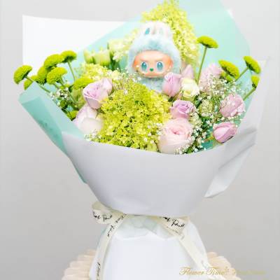 Bouquet of pink roses and green button mums with a plush toy centerpiece