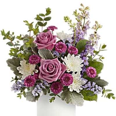 Lavender roses and white daisies in a white vase