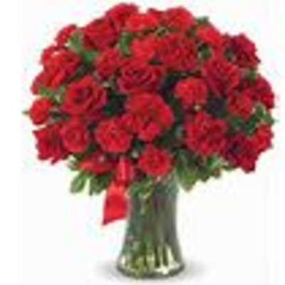Large bouquet of red roses in a clear glass vase