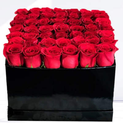 Box of red roses in a black square container