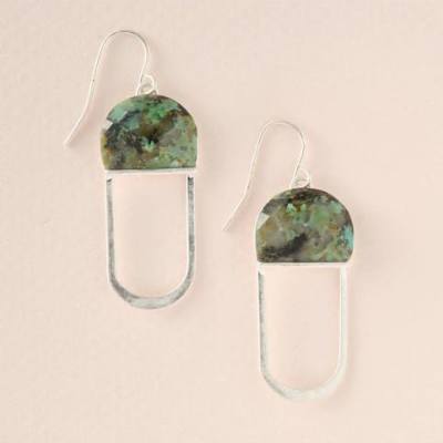 Pair of silver drop earrings with green marbled semicircle tops on a pale background