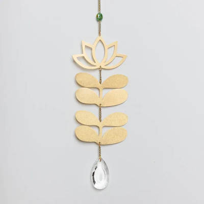 Gold lotus and leaf metal hanging ornament with clear teardrop crystal on a chain