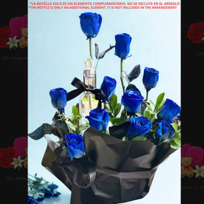 Bouquet of blue roses wrapped in black paper with a bottle centerpiece