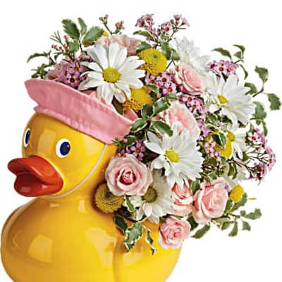 Yellow duck-shaped vase with pink and white flowers
