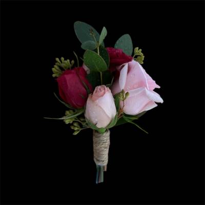 Small bouquet of pink and red roses with eucalyptus