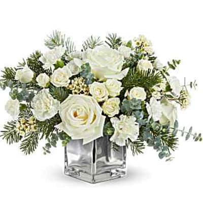 White rose bouquet in a clear square vase